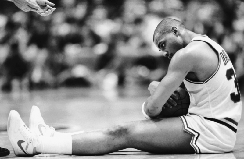 Barkley clutches the ball after being fouled during the 1986 playoffs. (Photo credit: Peter Morgan/AP)